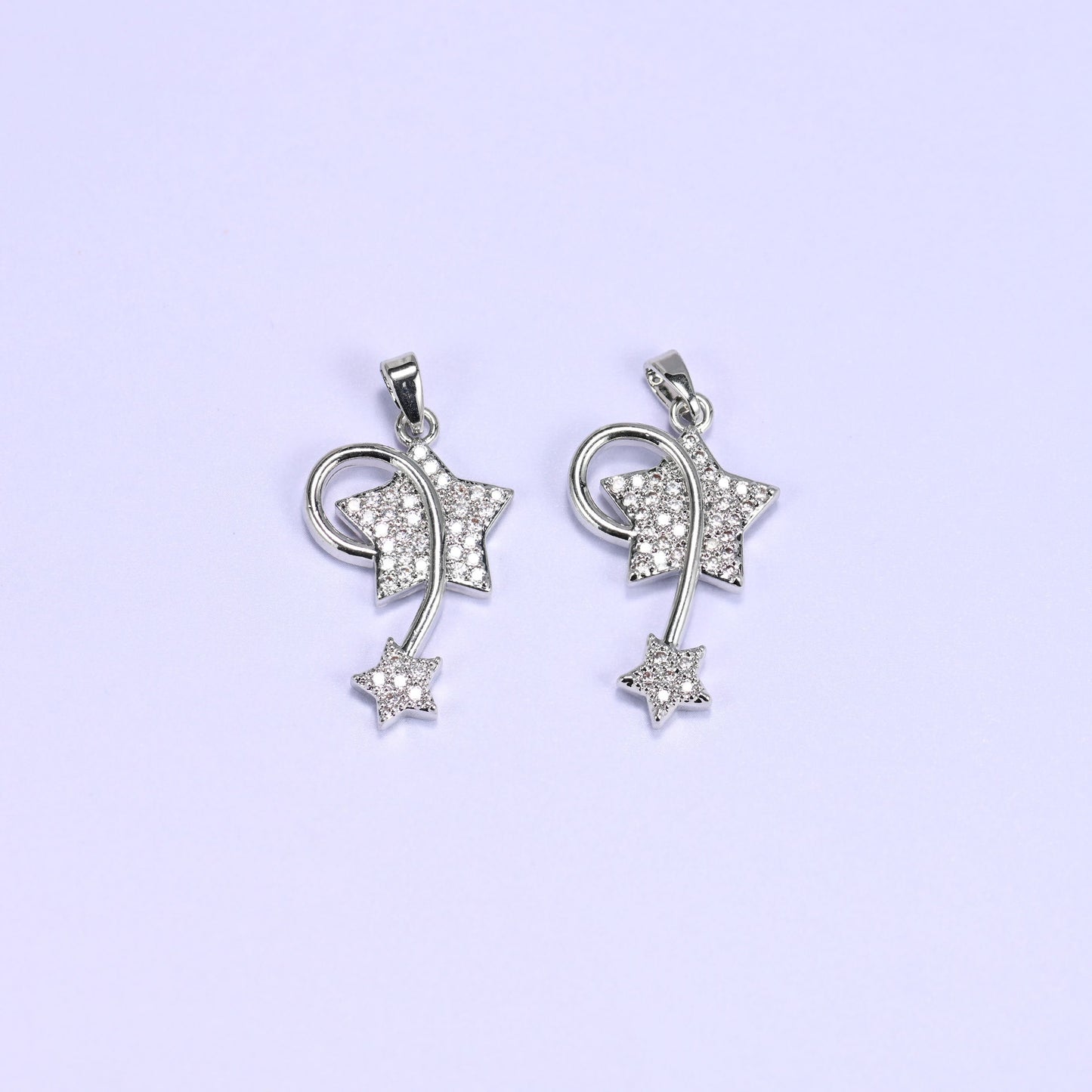 Shooting star charm with zircon pave stars and a swirling wire trail