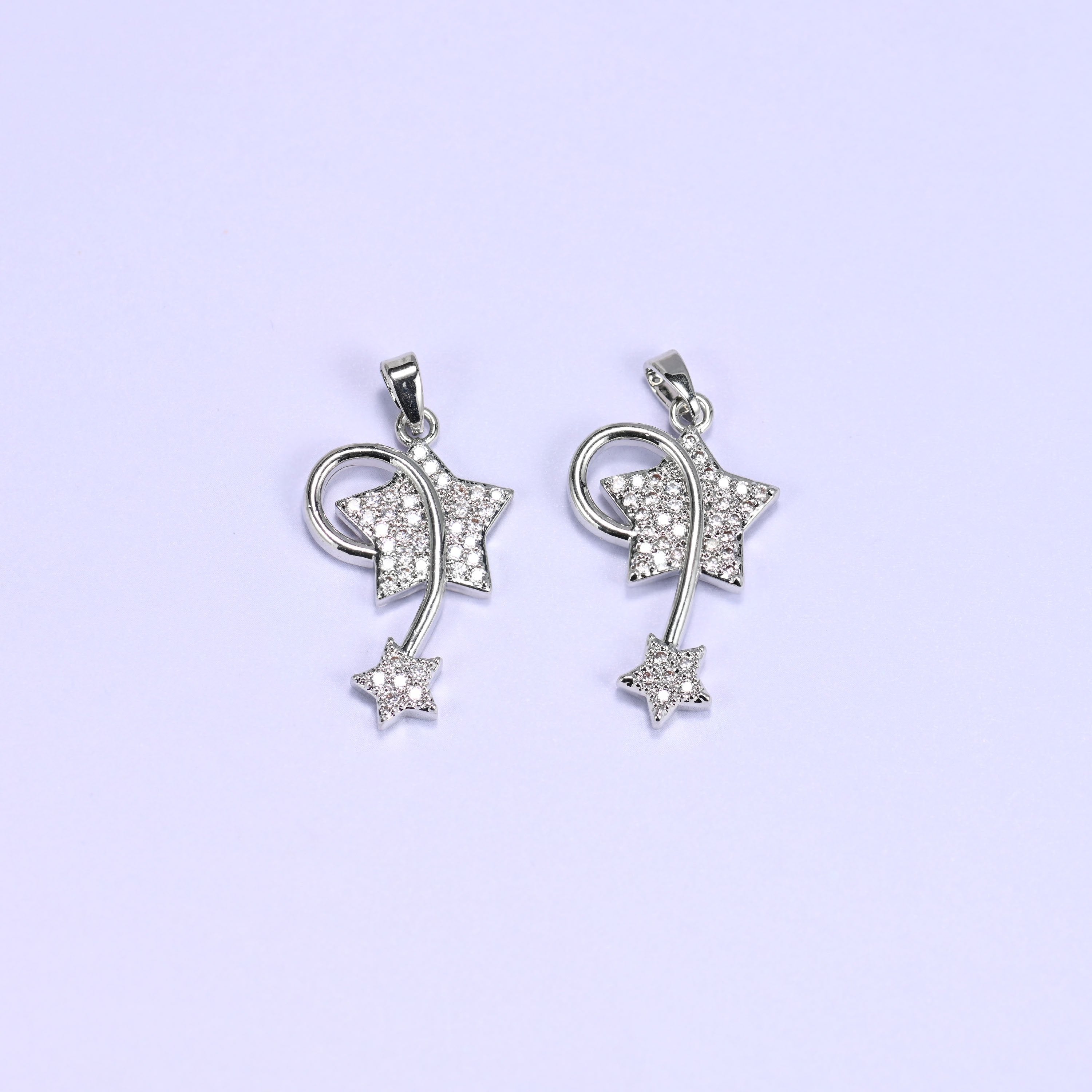 Shooting star charm with zircon pave stars and a swirling wire trail