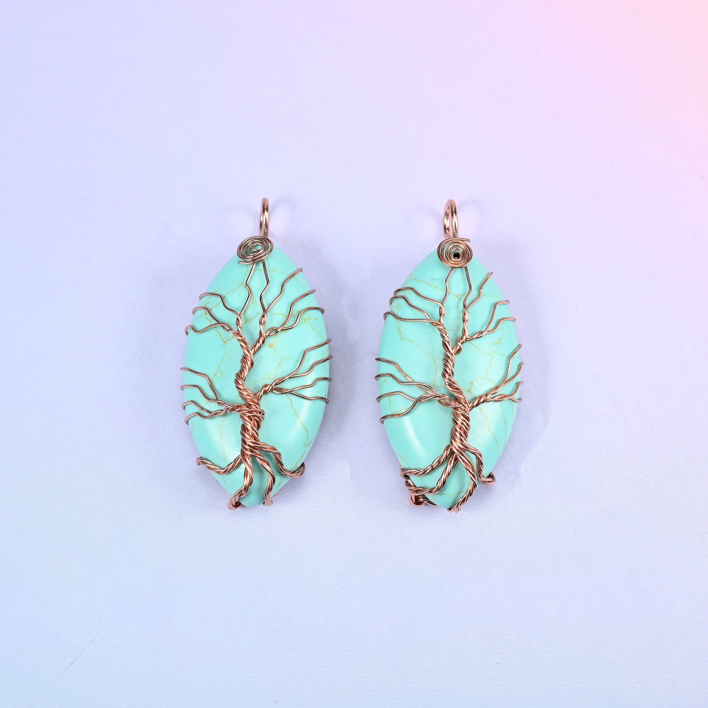 Oval Crystal Pendant with Copper Wired Tree in mint green stone, a matched pair with the copper trunk rising into a wrapped loop at the top.
