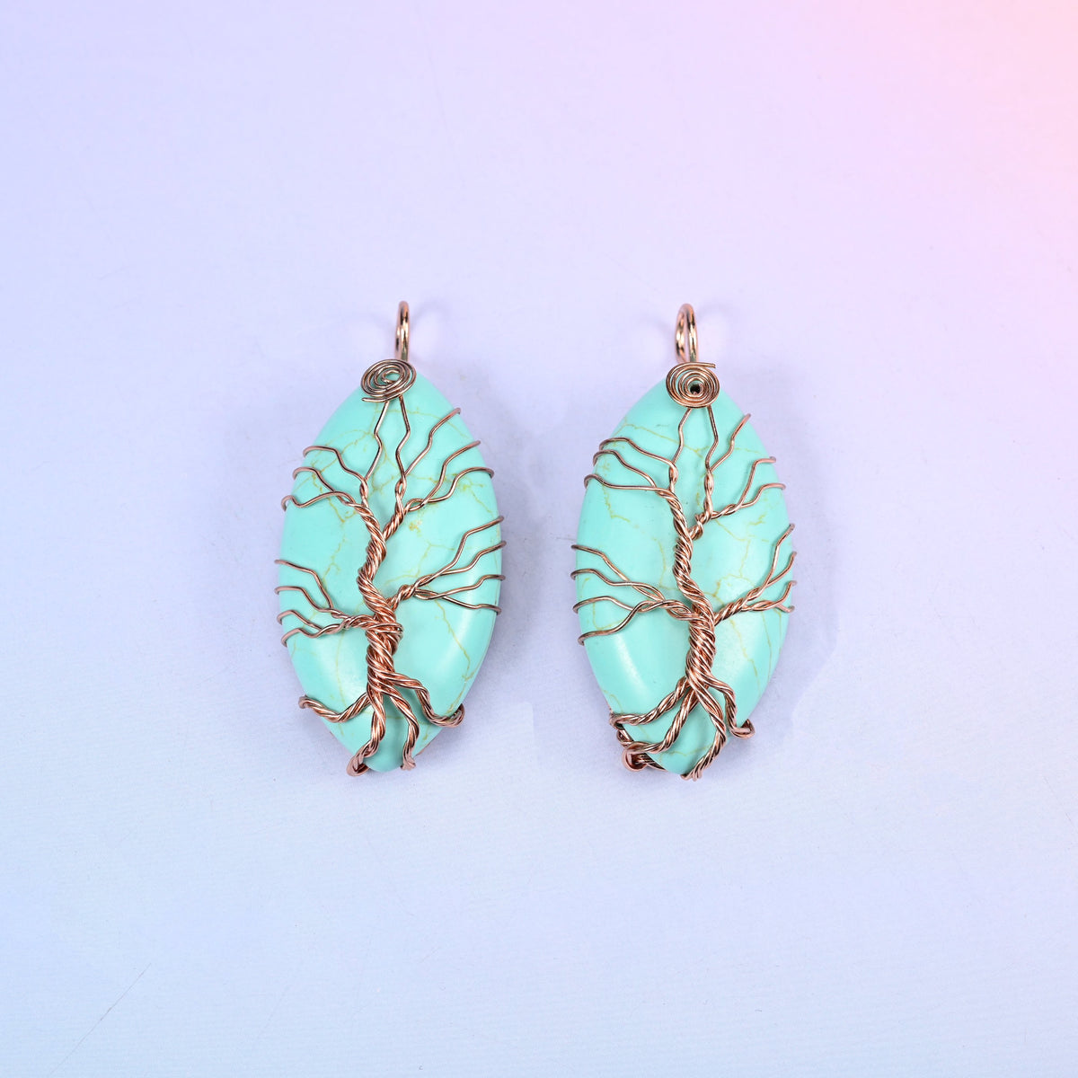 Oval Crystal Pendant with Copper Wired Tree in mint green stone, a matched pair with the copper trunk rising into a wrapped loop at the top.