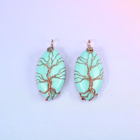 Oval Crystal Pendant with Copper Wired Tree in mint green stone, a matched pair with the copper trunk rising into a wrapped loop at the top.