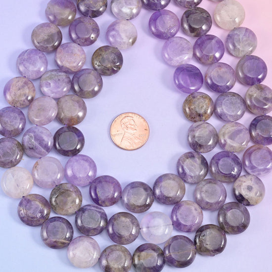 Amethyst coin loop framing a penny to show the 15mm bead scale