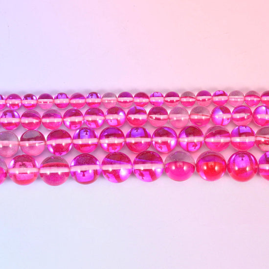Mystic Aura beads in raspberry-pink iridescent glass with violet and gold shifts