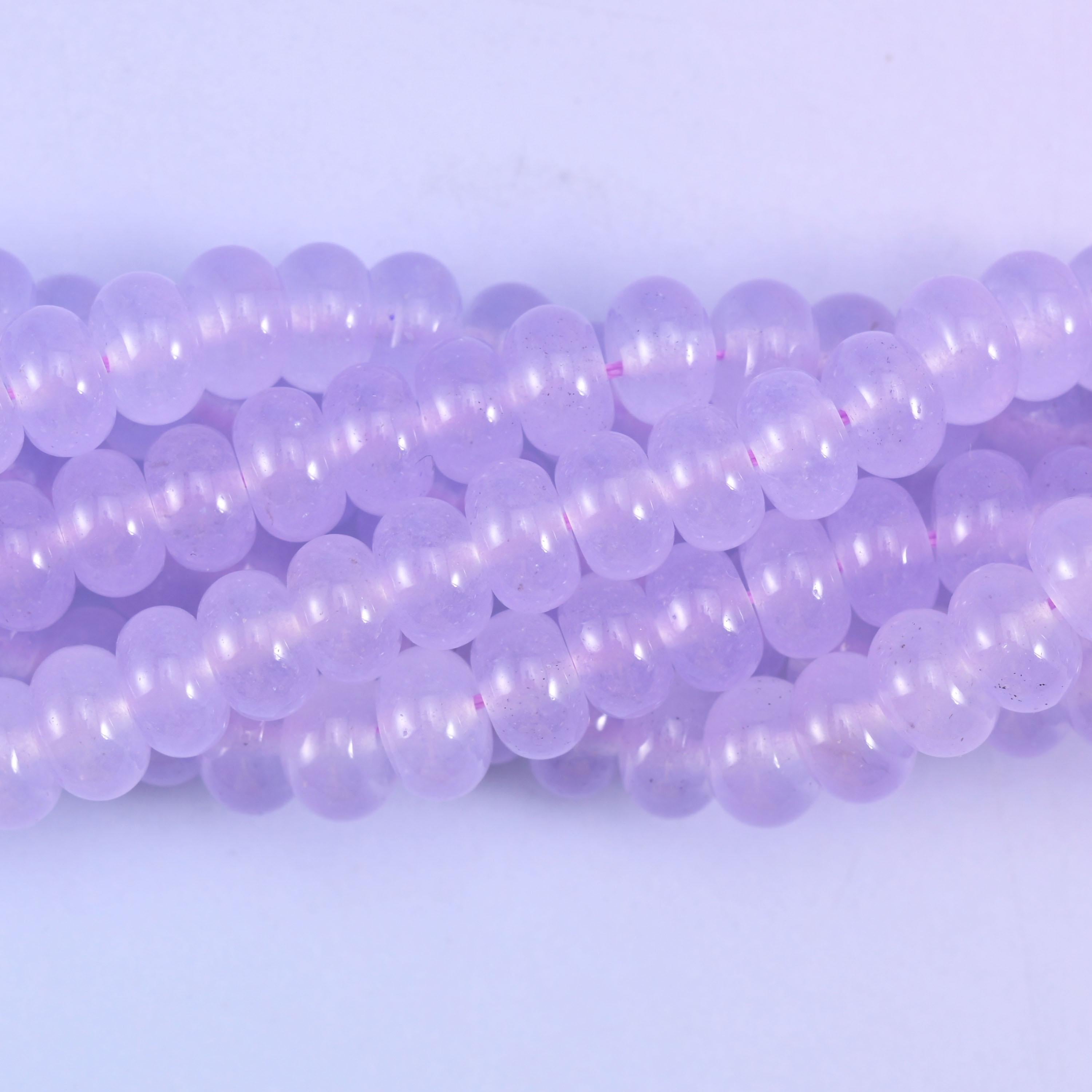 Smooth rondelle cut dyed jade beads with a polished surface