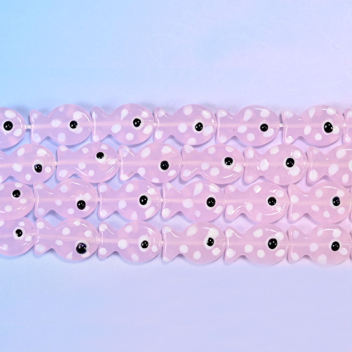 Fish glass beads in milky blush pink with white dots