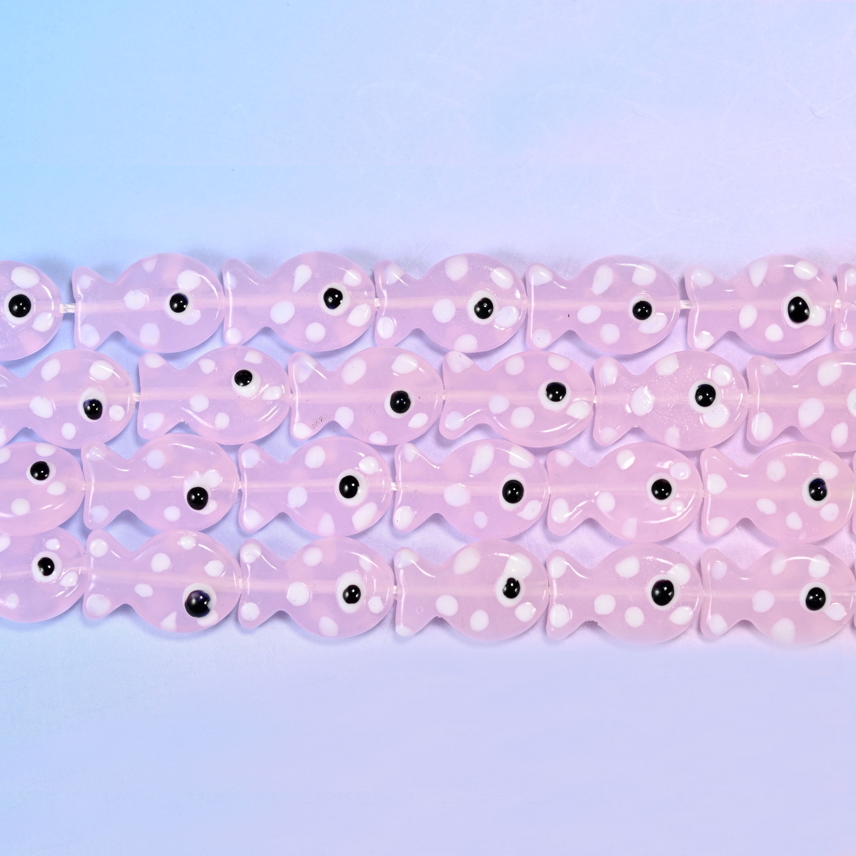 Fish glass beads in milky blush pink with white dots