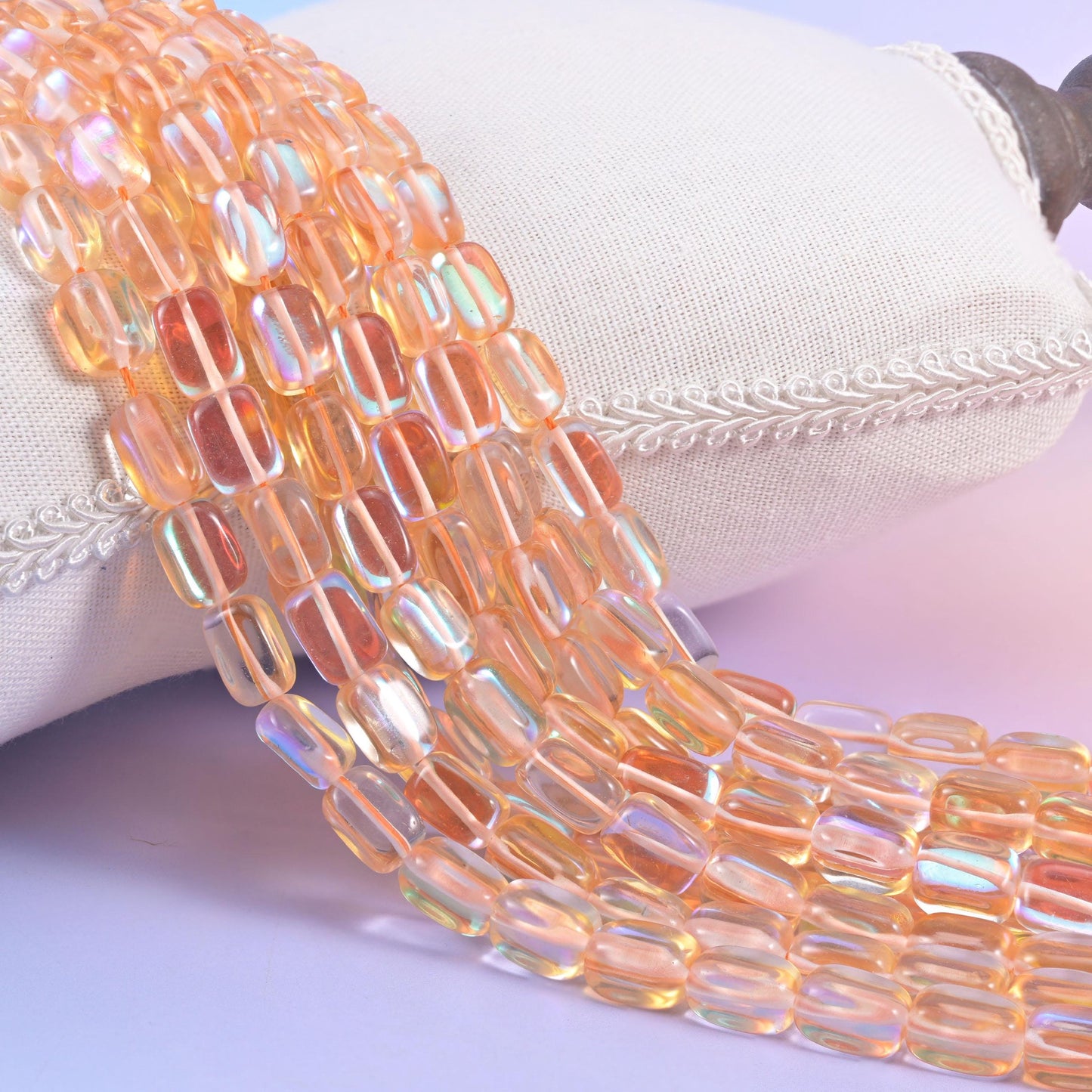 Orange Mystic Aura glass beads in a rectangular cut with a glossy transparent finish