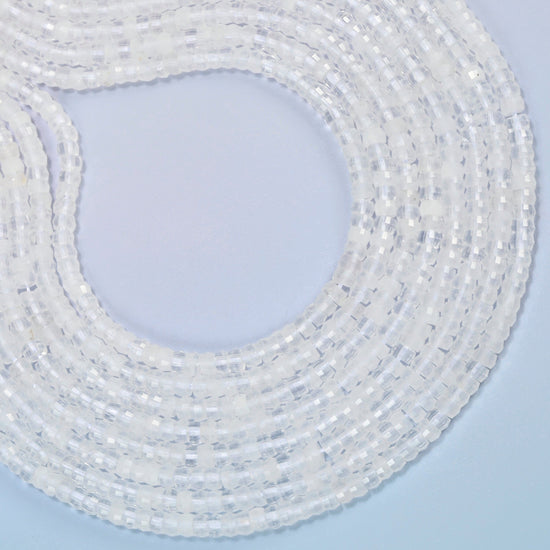 Clear quartz faceted heishi disc beads curved into an open loop, clear and milky white beads