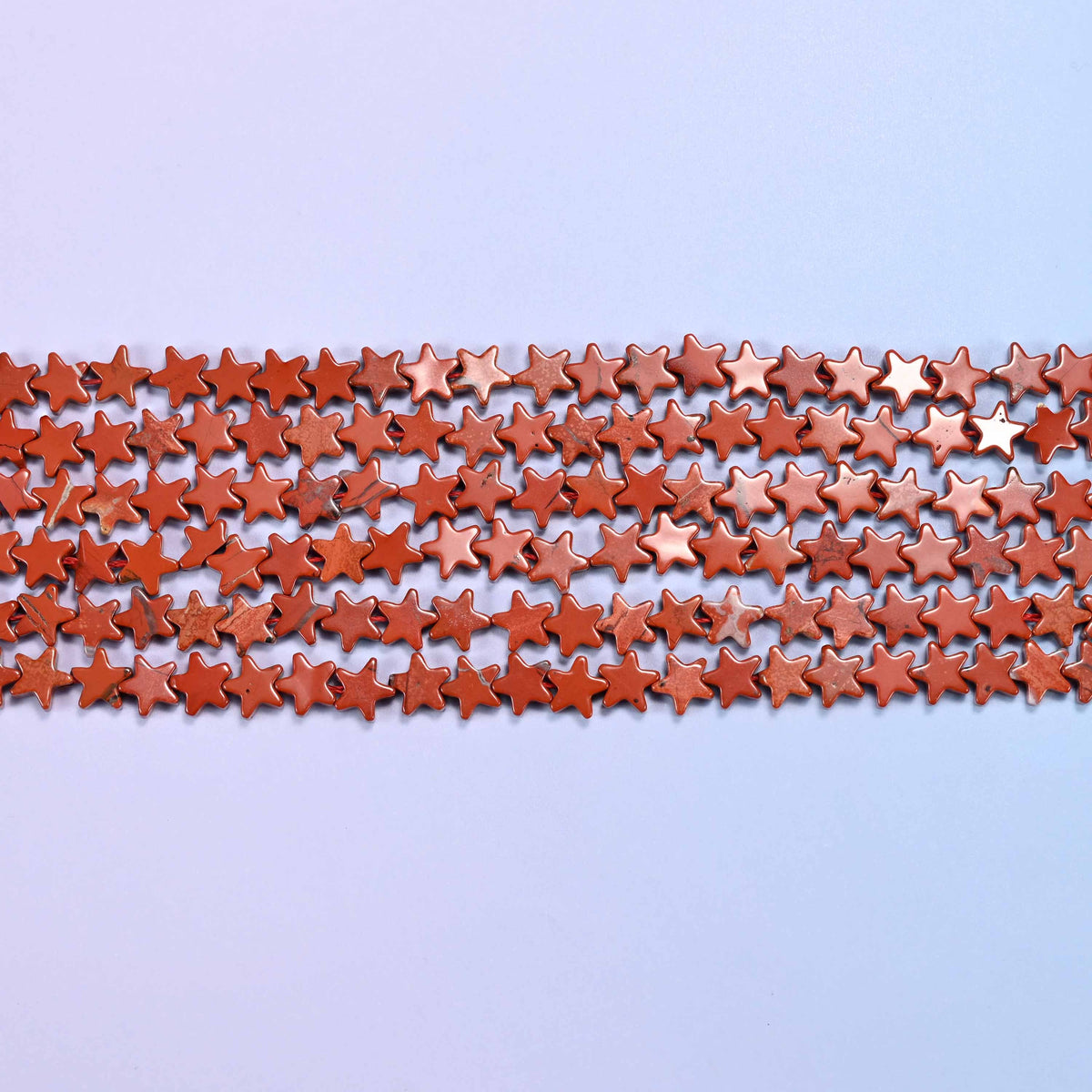 Red jasper flat star beads, 15 inch strand