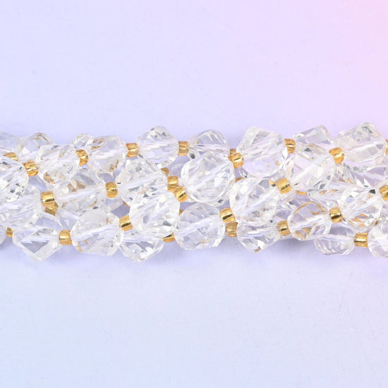 Colourless transparent quartz cut with facets that wind around the bead in a shallow spiral, so light runs along the twist instead of sitting still. Two sizes, 8mm and 10mm.