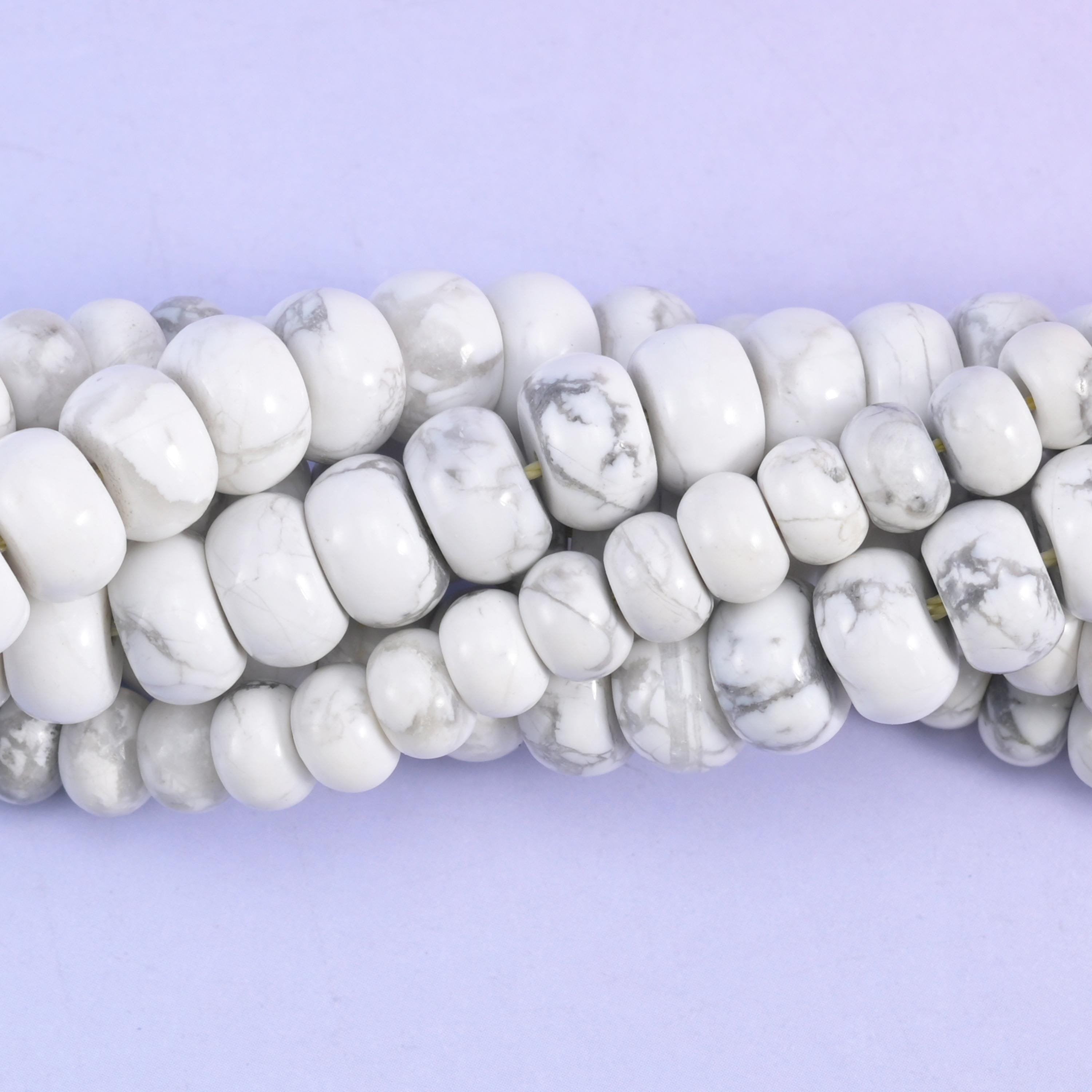 Rondelle cut White Howlite beads with a smooth polished finish