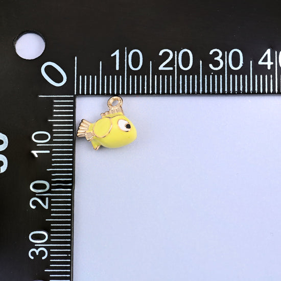 Fish charm measured at 12mm, 18K gold plated brass with yellow green enamel.
