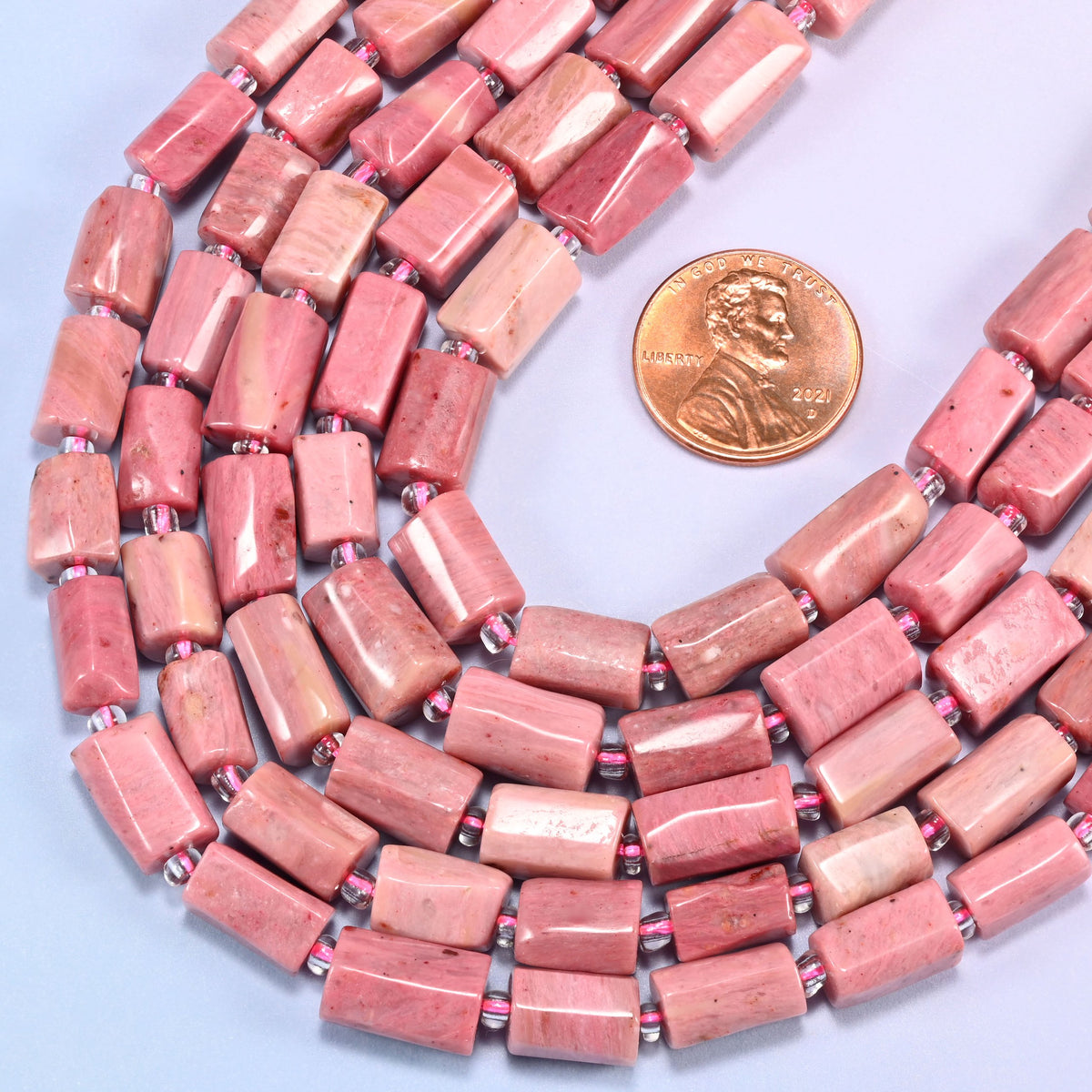Coiled strands of Pink Rhodonite faceted tube beads, 9x7mm to 11x7mm natural stone tubes with fine red-brown streaking