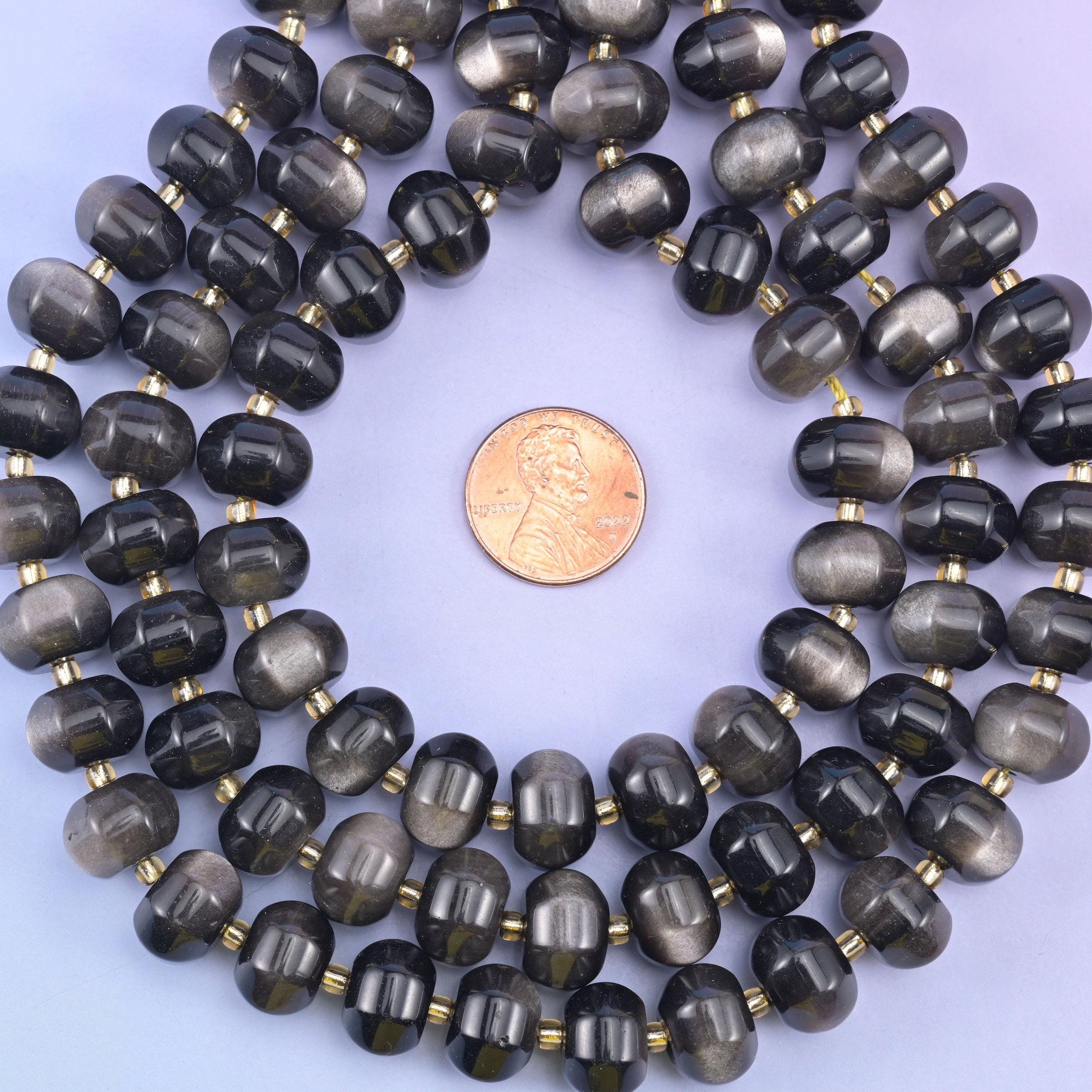 Silver obsidian smooth pumpkin beads in smoky black with shimmering silver sheen