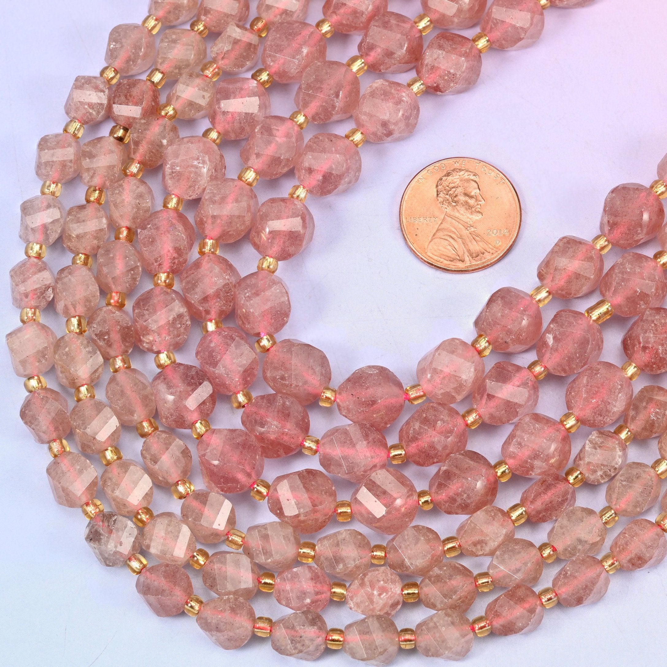 Faceted spiral twist cut Strawberry Quartz beads