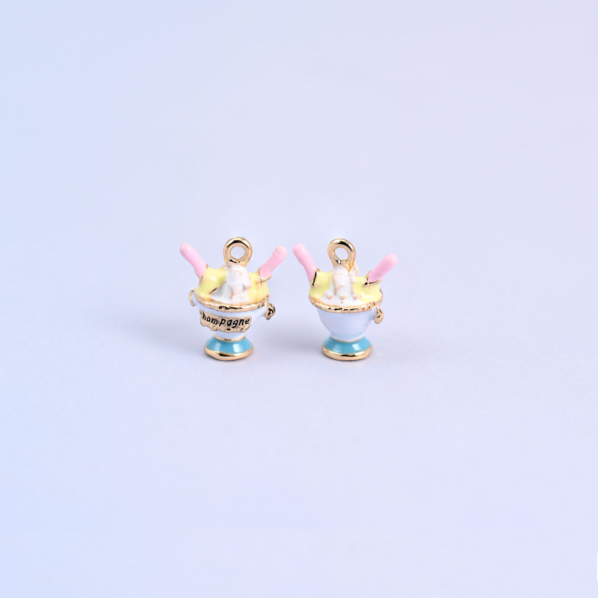 White ice cream charm shown front and back, sundae coupe with a light blue foot and light yellow topping.
