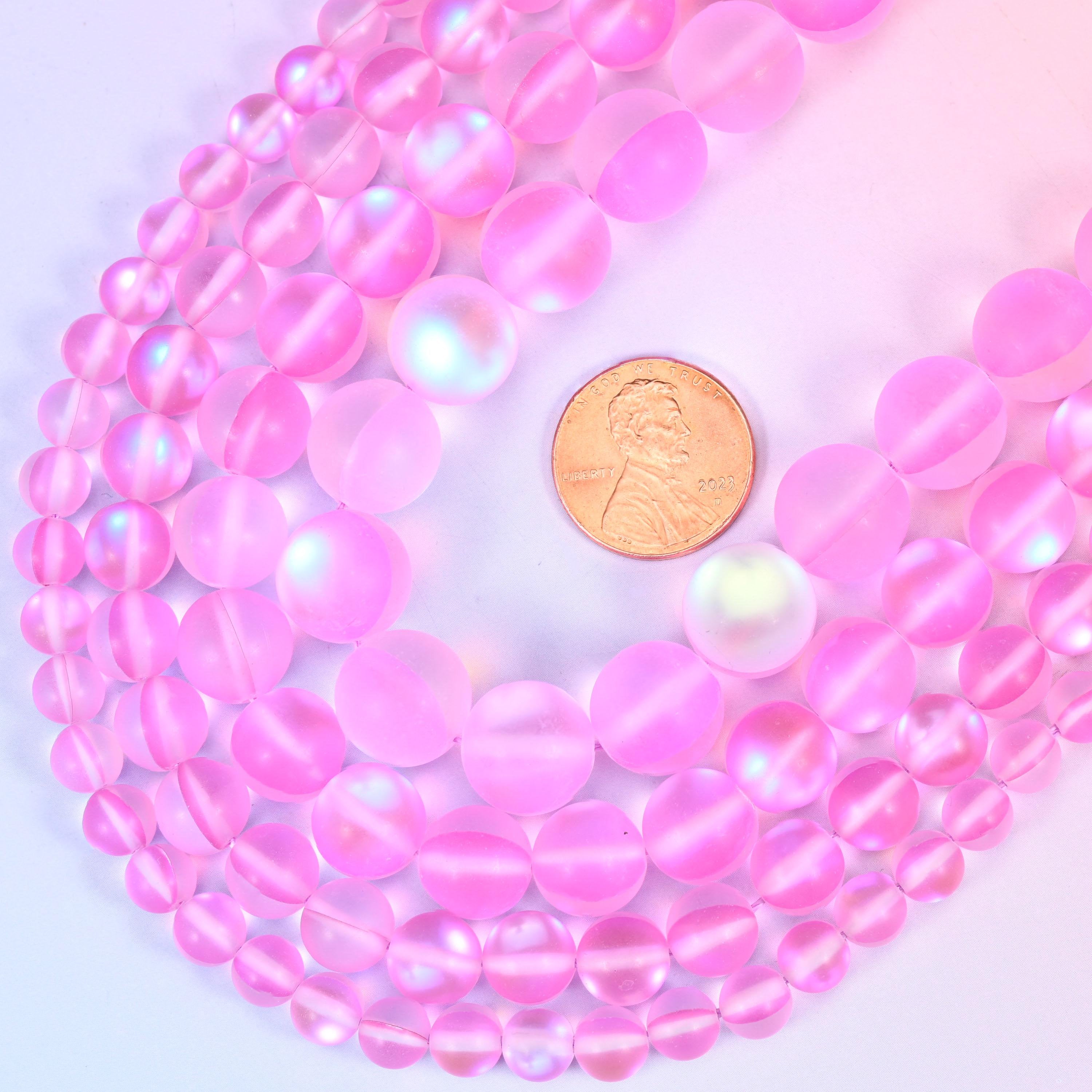 Round frosted pink glass beads with sea-glass surface