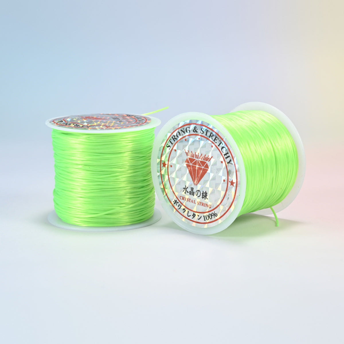 Two rolls of lime green 0.7-0.8mm elastic stretch string, glossy polyurethane bead cord with a holographic label