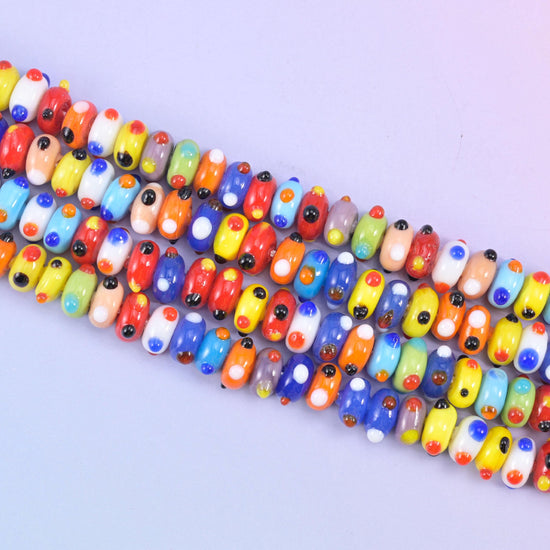 Multi-Color Dotted Donut Glass Beads, each carrying contrasting hand-applied dots