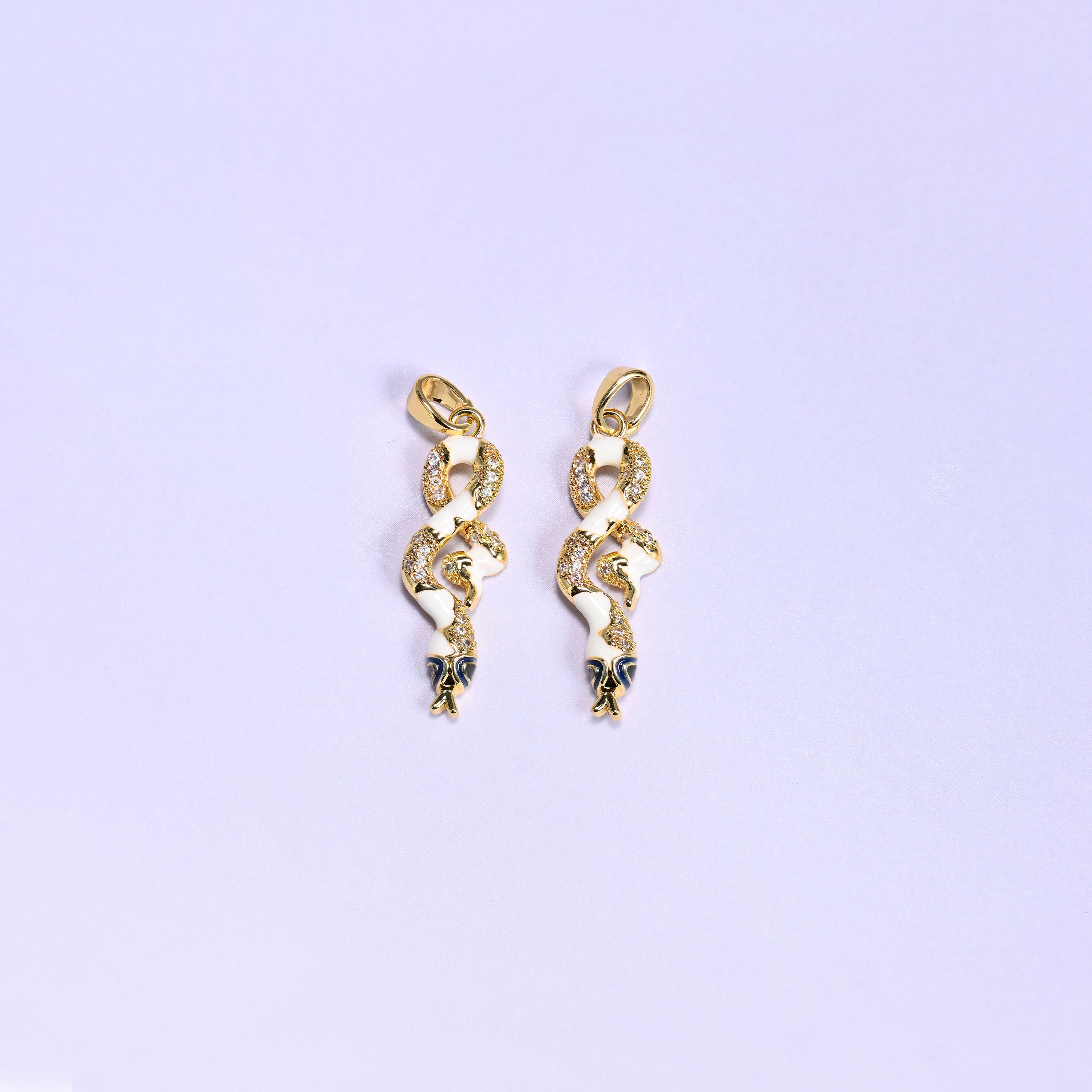 Enamel Snake Zirconia Charms in white, two 18K gold plated coiled snake pendants with white enamel bodies, clear zirconia pave and navy enamel heads.