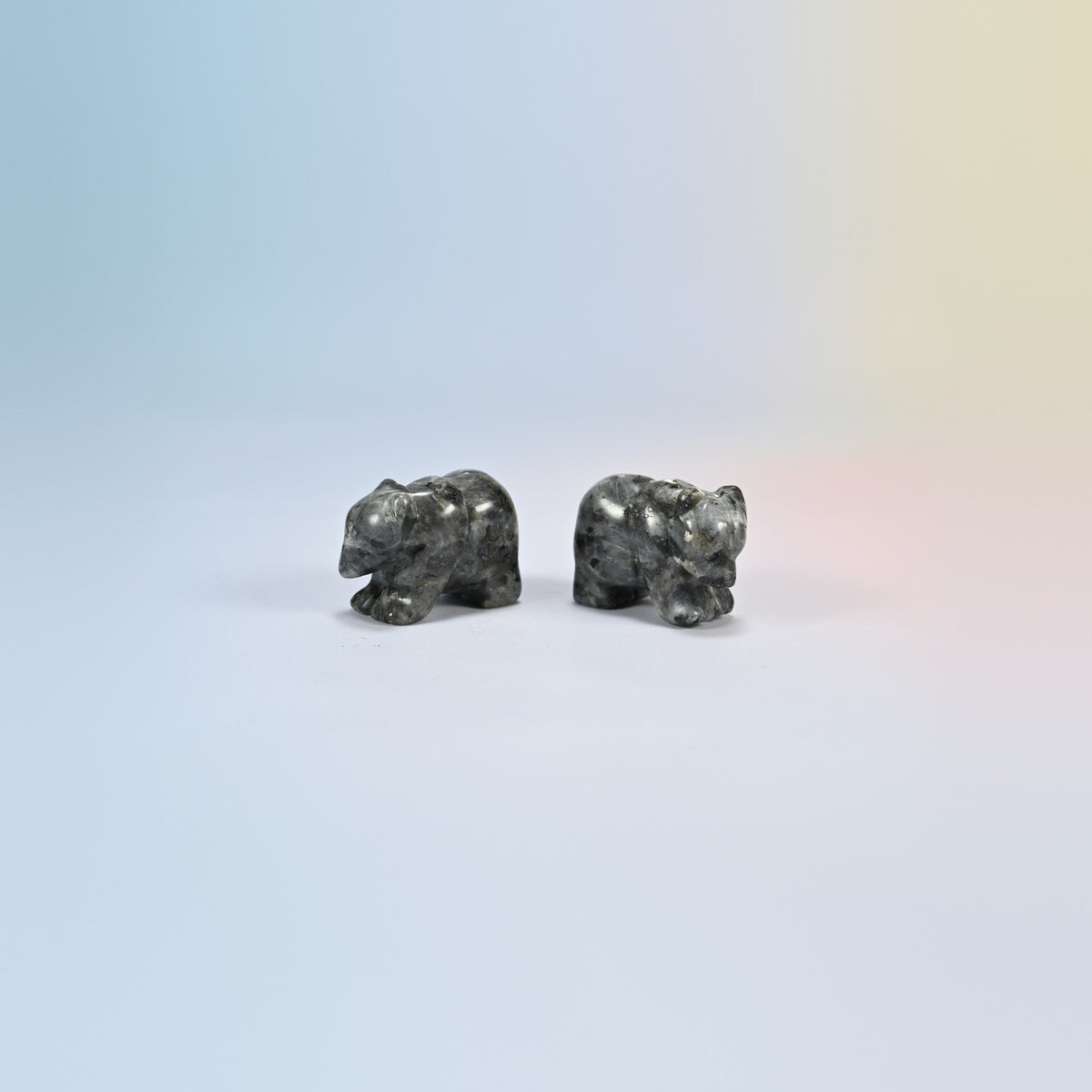 Two 1.5 inch black labradorite bear crystal carvings, dark gray natural stone with black spots