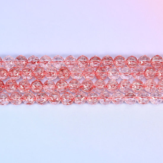 Transparent red faceted round glass beads in soft rosy red