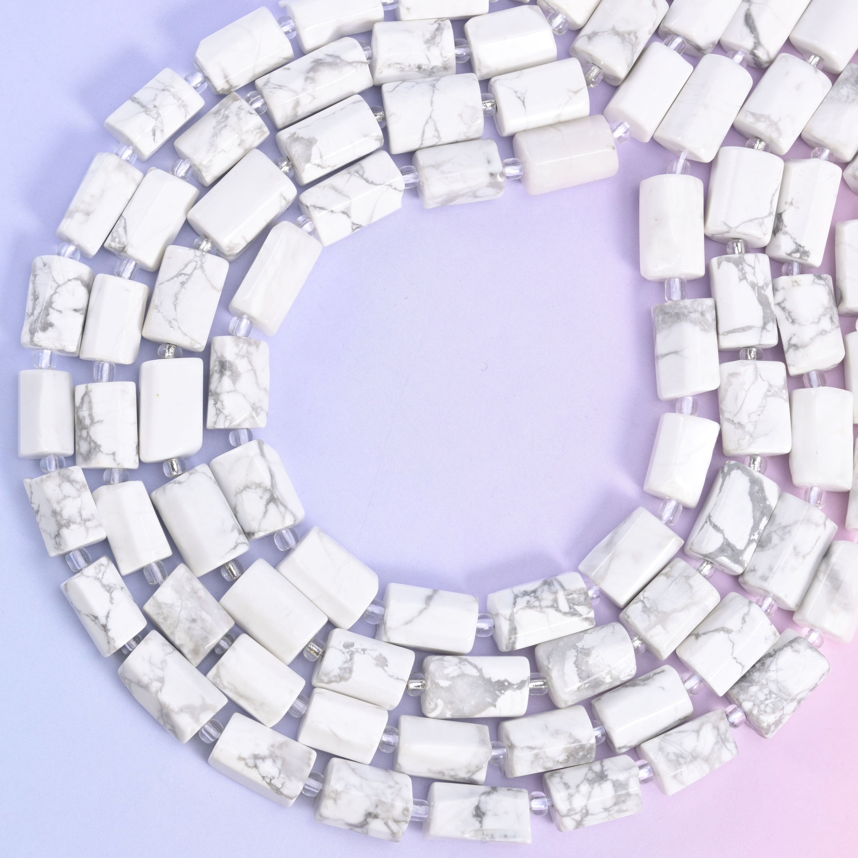 White Howlite faceted tube beads, approximately 29 beads per strand