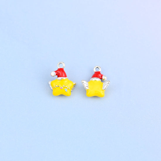 Two star charms in red hats, front and back, with white pom hats and tiny colored dots on the star face.