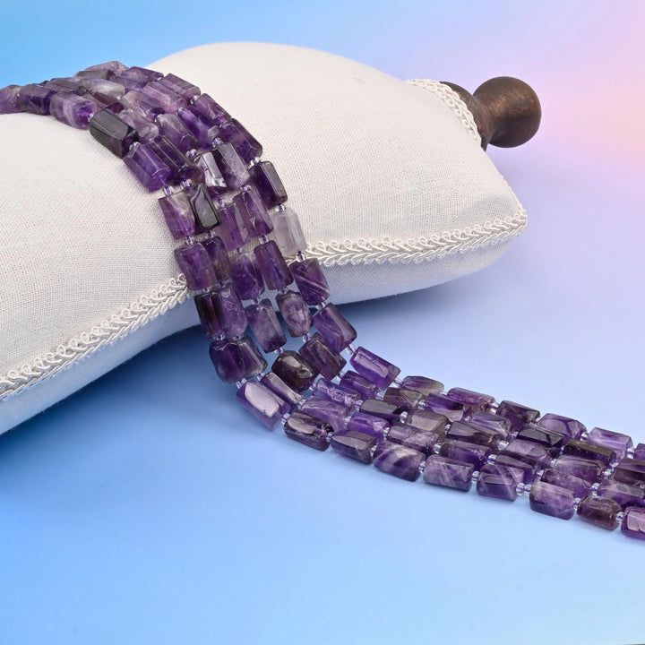Natural Chevron Amethyst faceted tube beads with distinctive purple chevron banding.