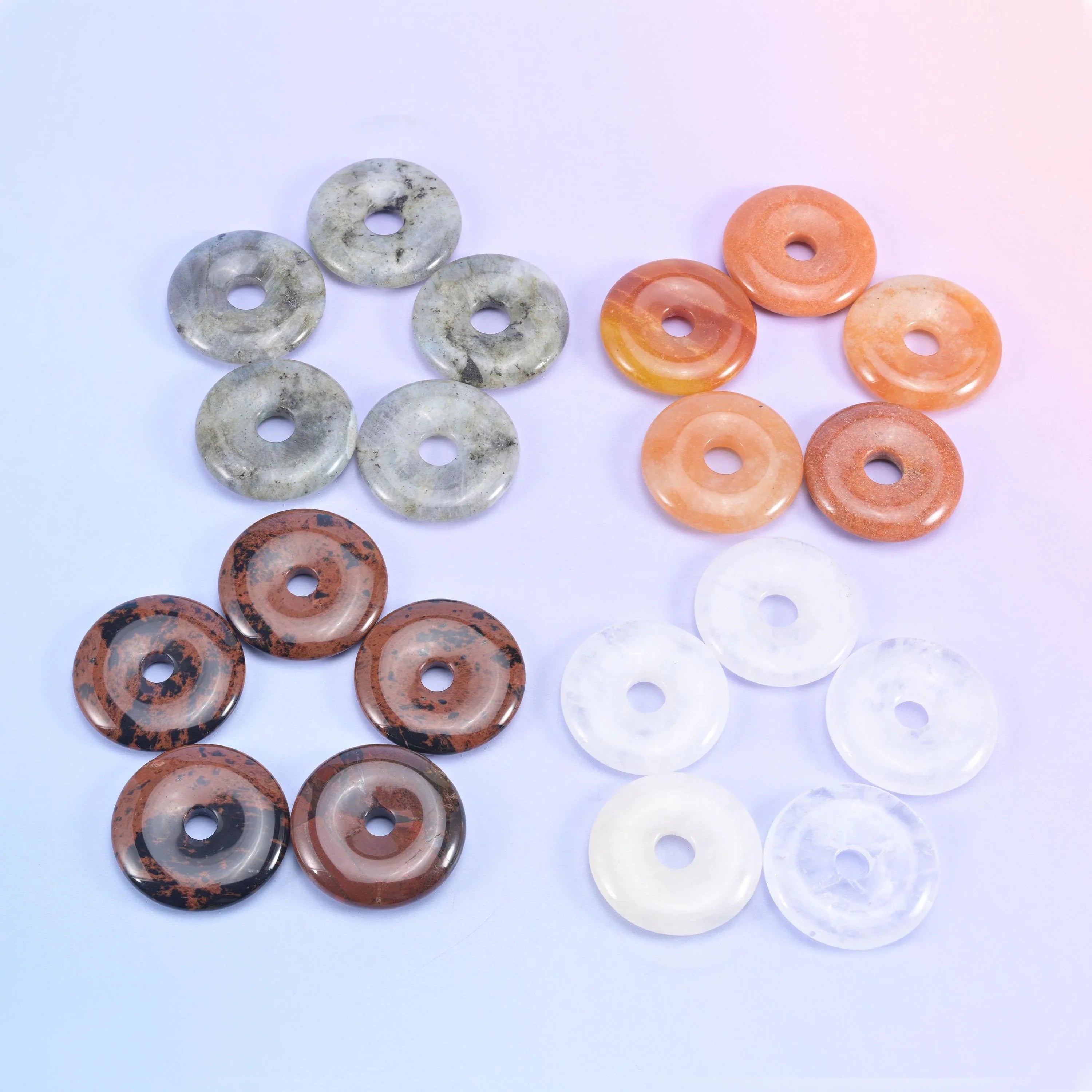 Donuts grouped in fours, speckled grey jasper, peach aventurine, brown mookaite and white quartz