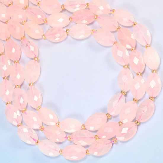 Rose quartz faceted flat oval beads curved into an open loop, translucent blush pink beads