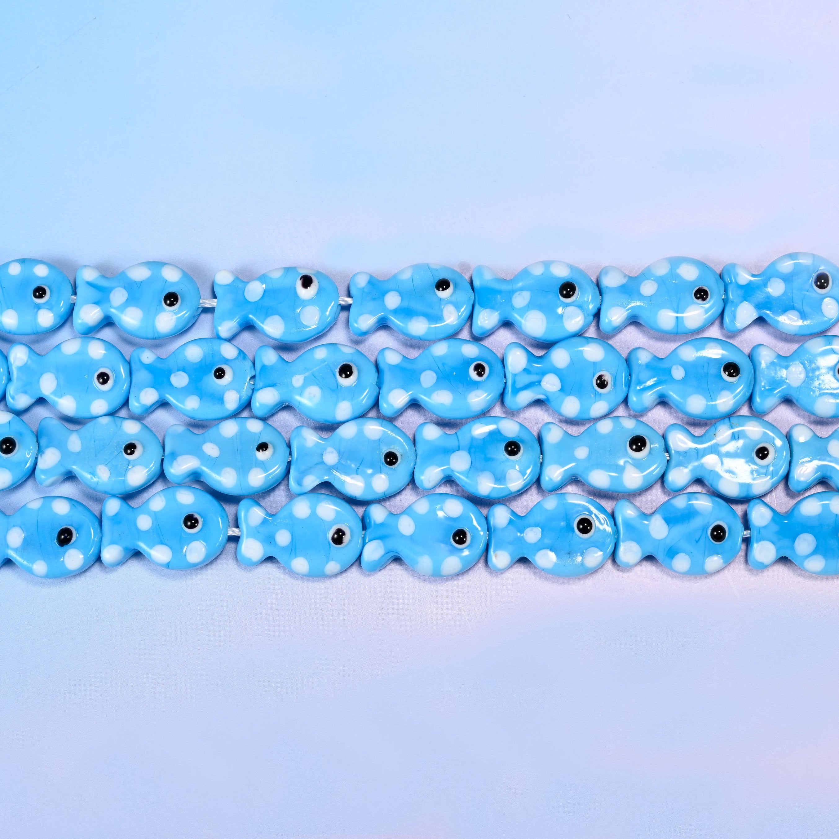 Fish glass beads in glossy opaque sky blue with white dots