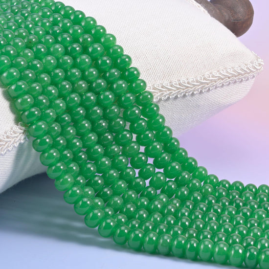 Green Dyed Jade smooth rondelle beads in a vivid emerald green