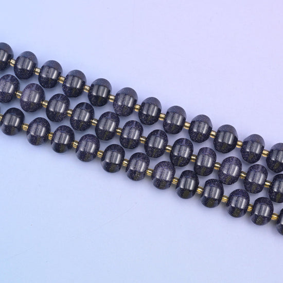 Diagonal run of 12x8mm Blue Sandstone pumpkin rondelles with small gold spacers