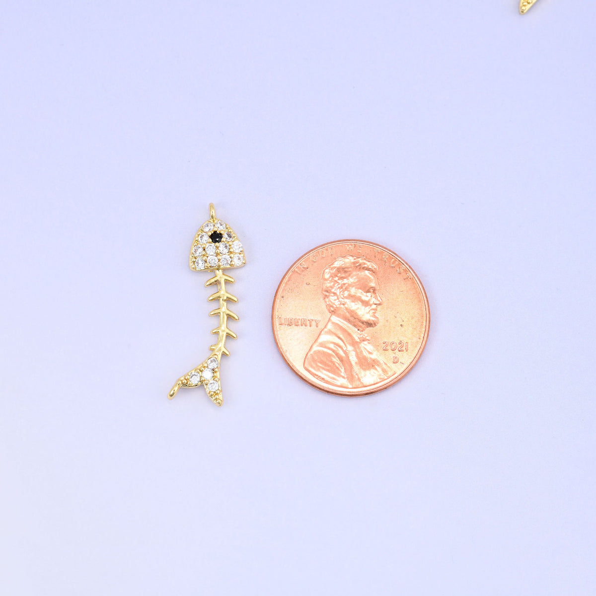 Fishbone Charm Pendant in gold and black