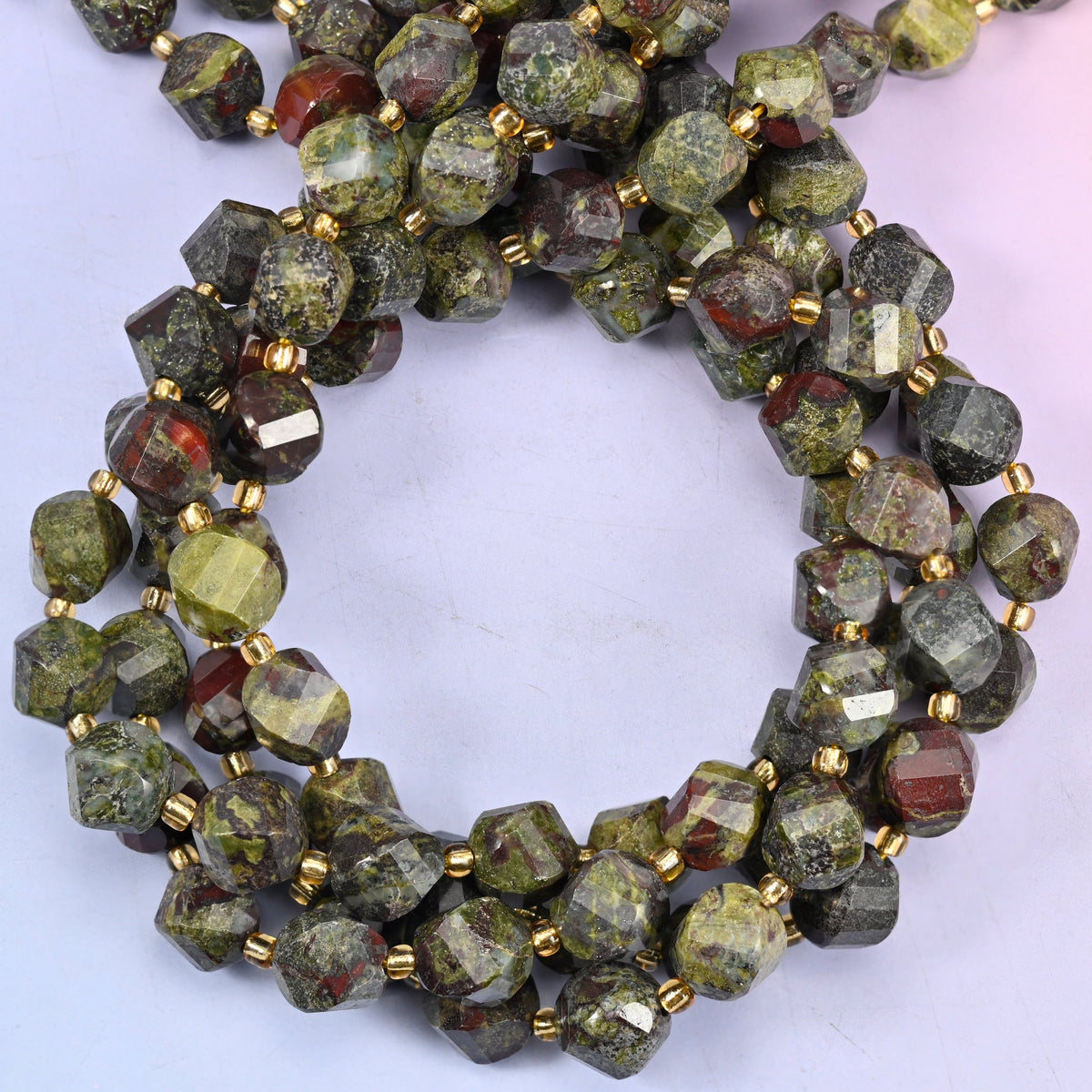 Natural dragon bloodstone beads in a 10mm faceted spiral twist cut