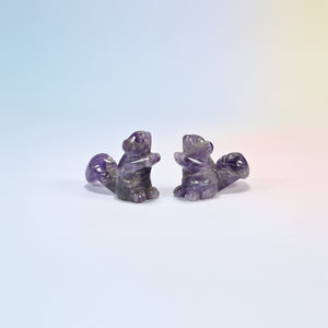 Two 2 inch natural amethyst long tail squirrel carvings, purple and white banding