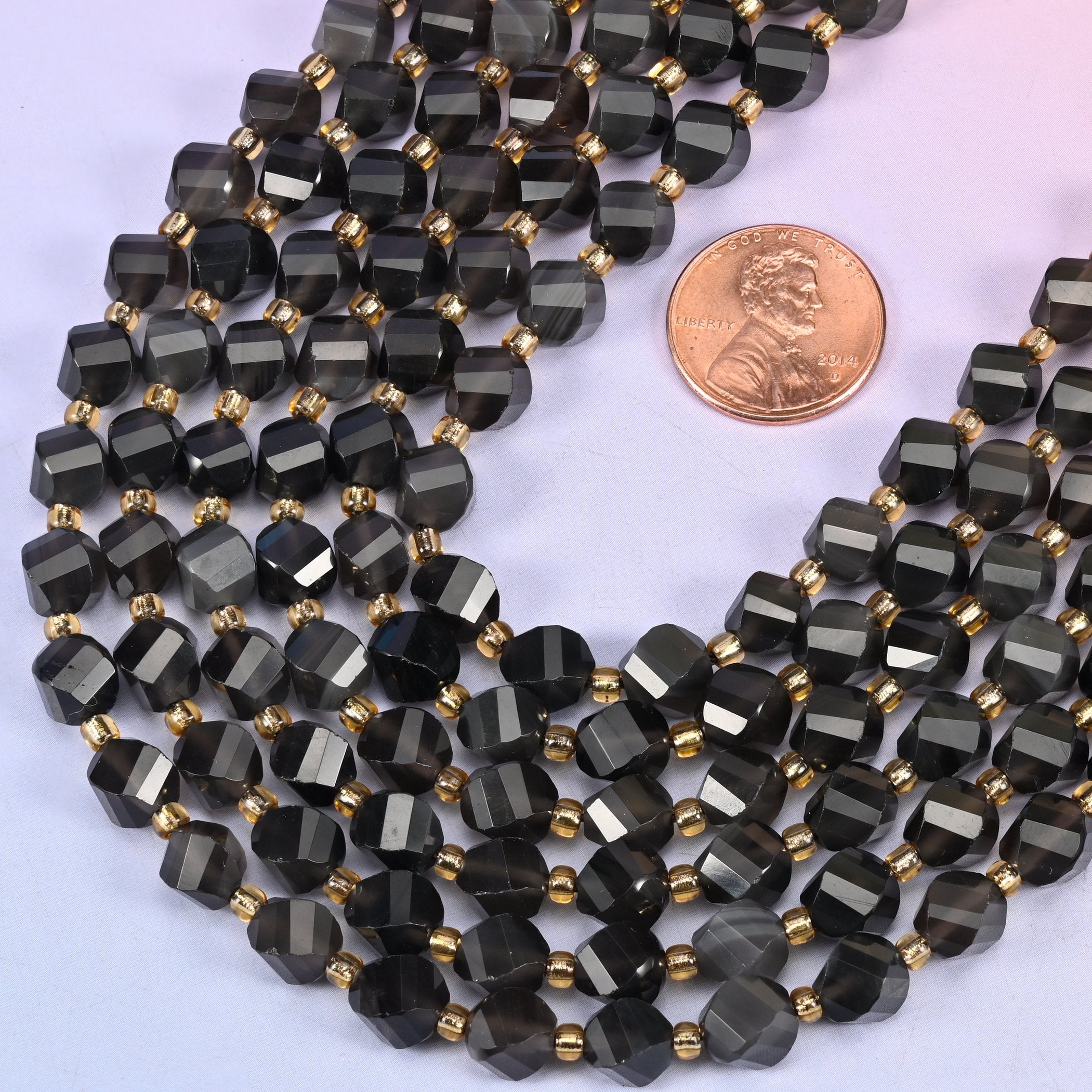 Ice obsidian natural stone beads with small gold spacer beads set between each 8mm faceted bead