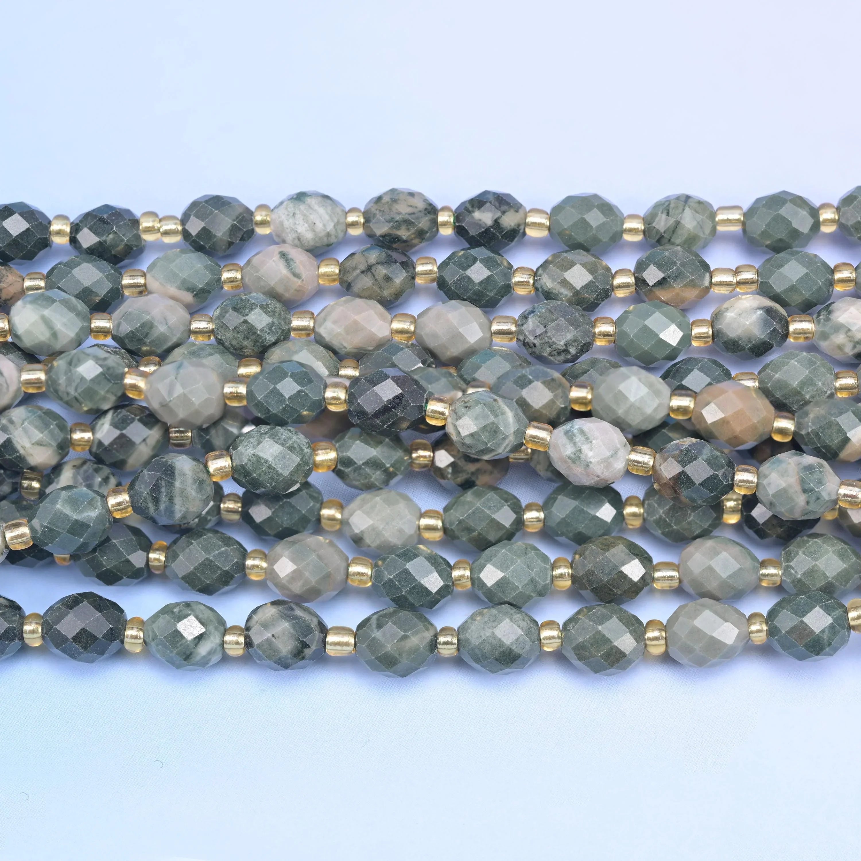 Faceted rice barrel cut green rhodonite beads