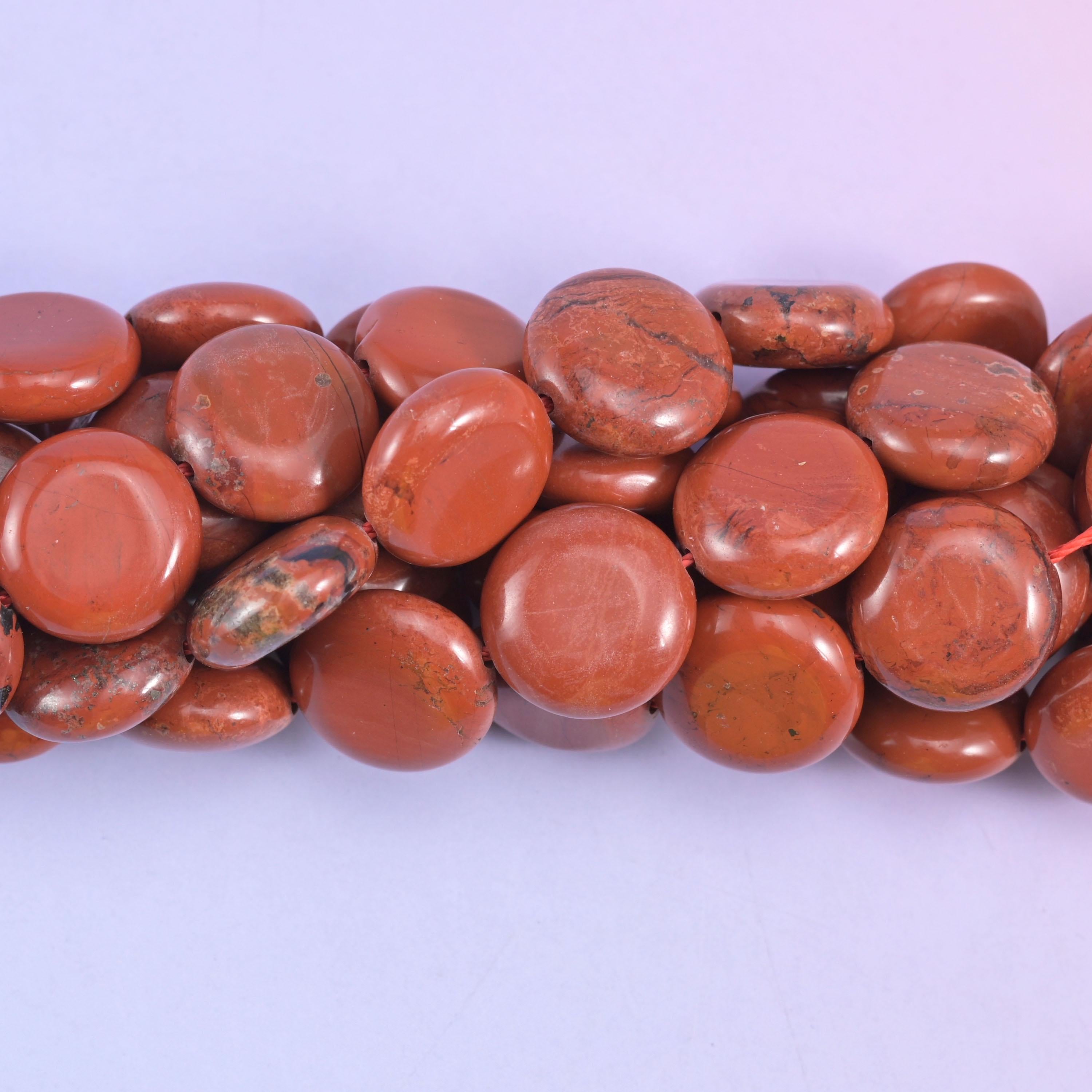 Coin cut Red Jasper beads with a glossy polished finish
