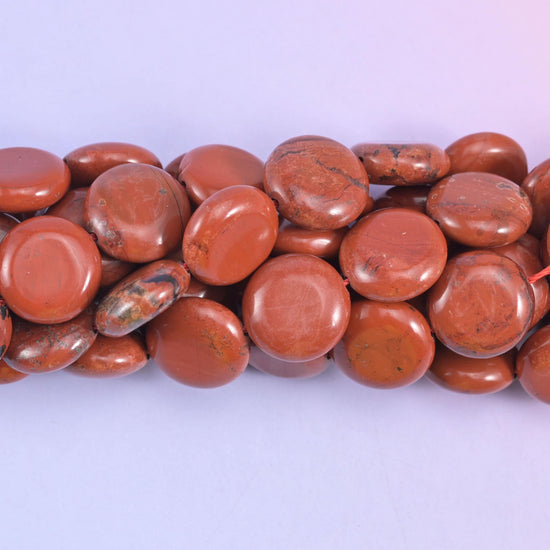 Coin cut Red Jasper beads with a glossy polished finish