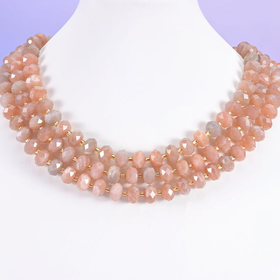 Orange sunstone faceted rondelle beads in warm peach and apricot shading to grey-beige