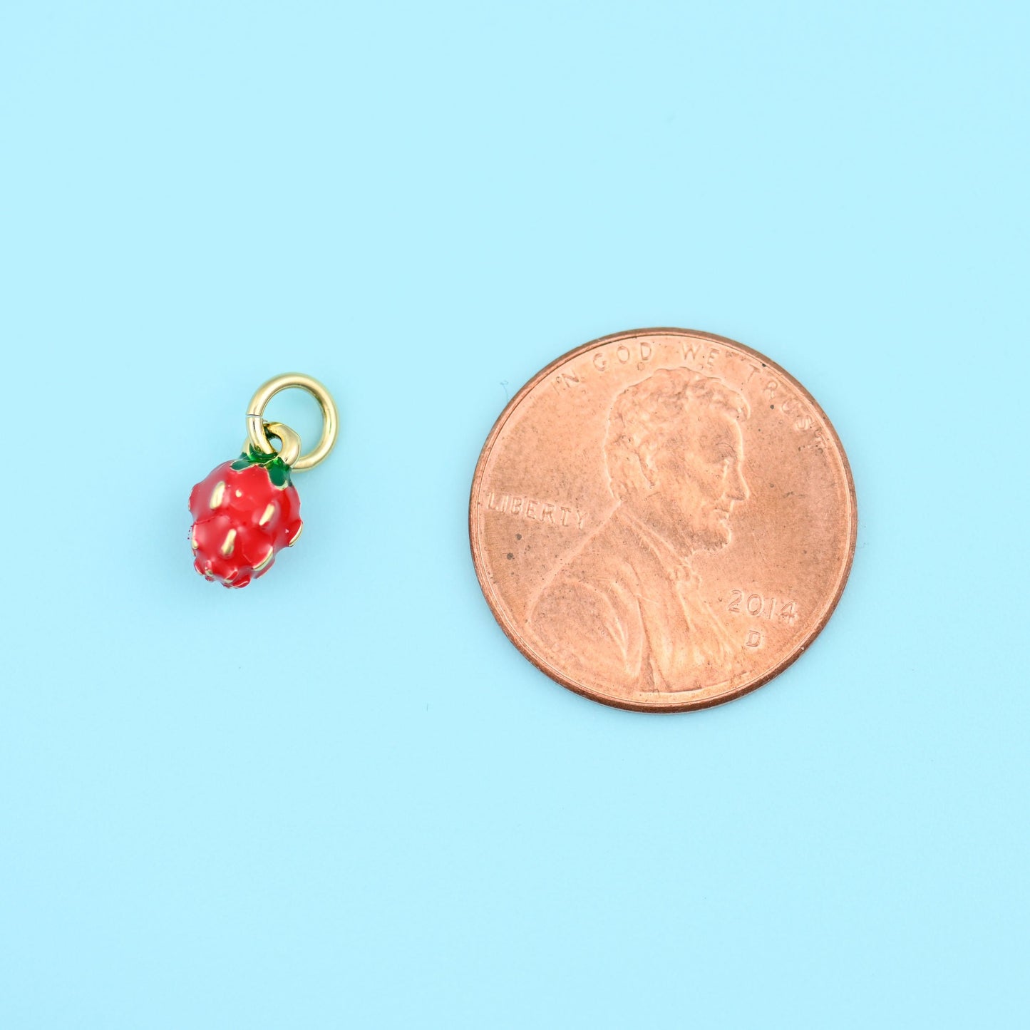 18K Gold Filled Tiny Strawberry Charm 8.57x5.20mm in glossy red with a green leaf cap on gold