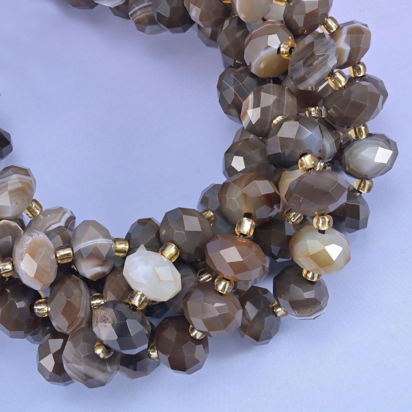 Faceted rondelle cut dyed brown strip agate beads