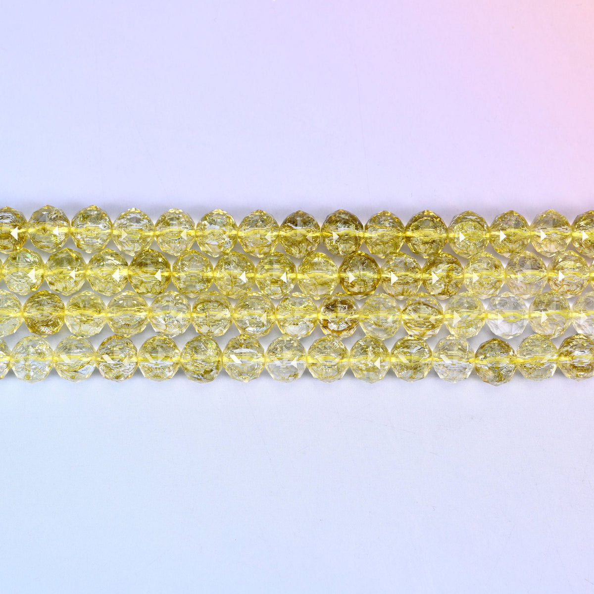 Transparent Lemon Yellow Faceted Round Glass Beads in a clear citrine-like lemon yellow