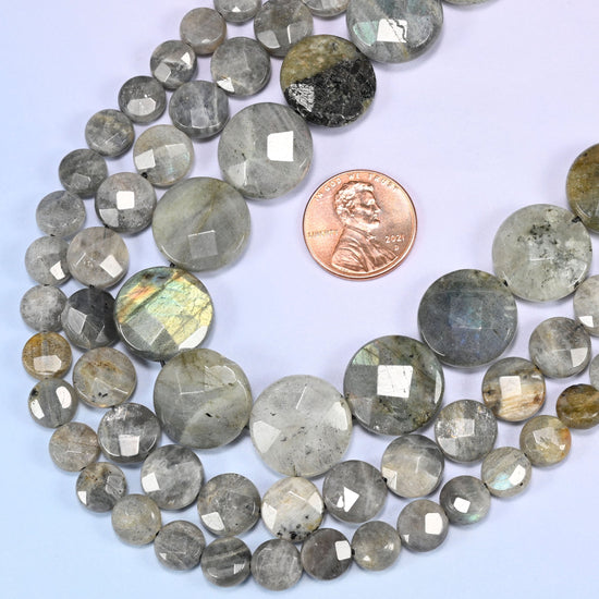 Gray Labradorite faceted coin beads in a deep loop, shown at their true size of 8mm to 16mm
