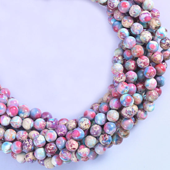 Sea sediment jasper round beads, approximately 50 beads per 15.5 inch strand