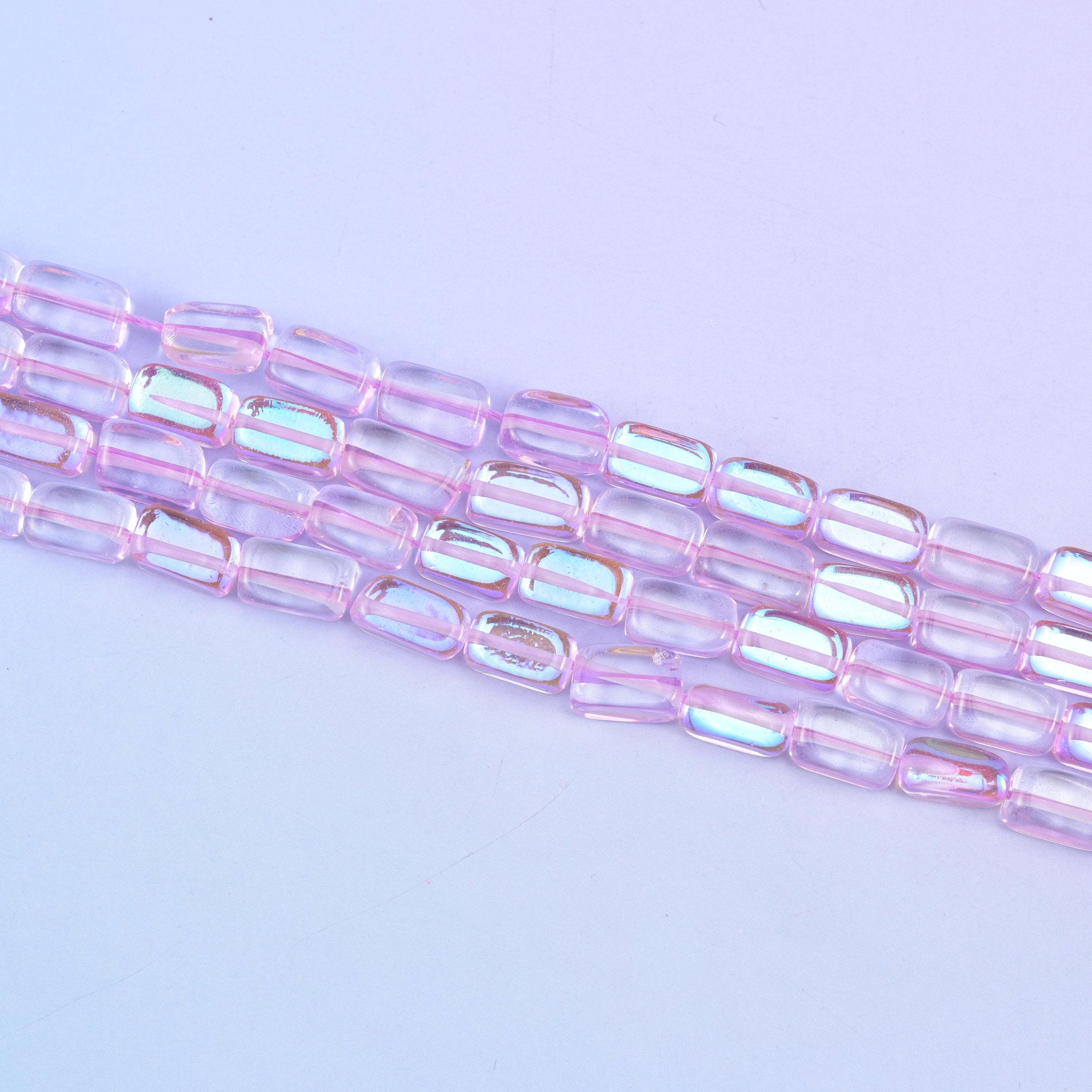 Light purple mystic aura beads in soft lilac-pink with a subtle iridescent glow