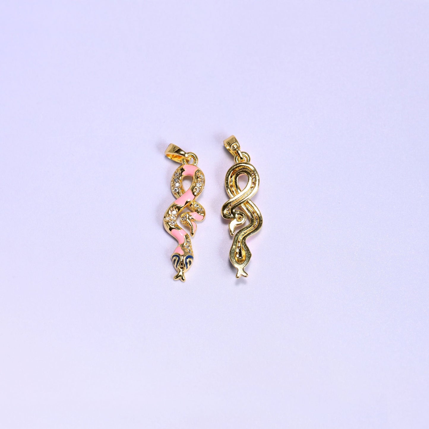 Coiled snake charm with a navy enamel head
