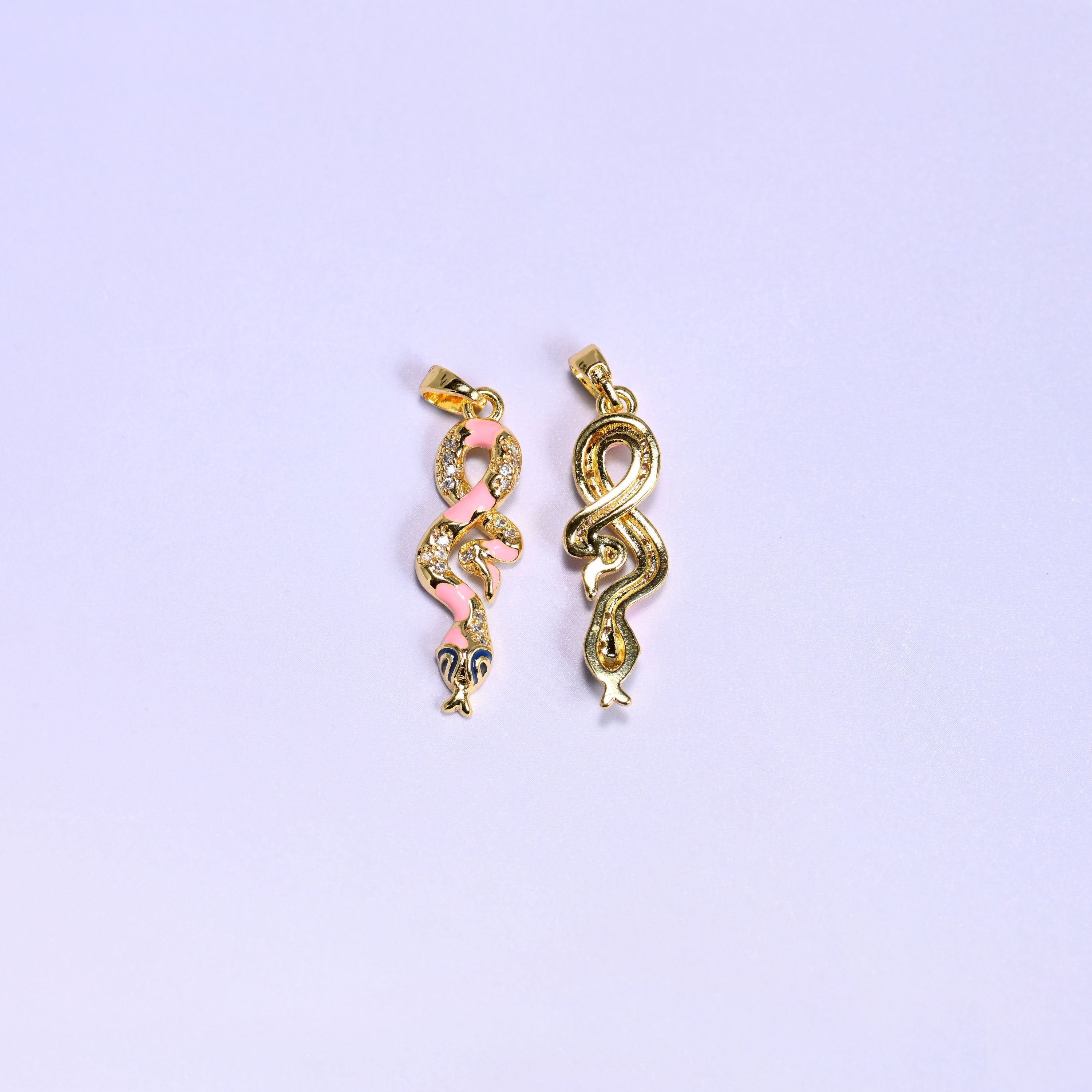 Coiled snake charm with a navy enamel head